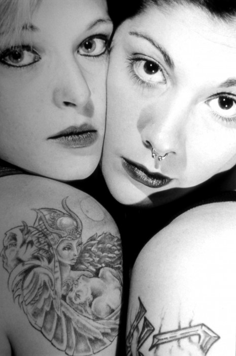 Two girls with tattoos